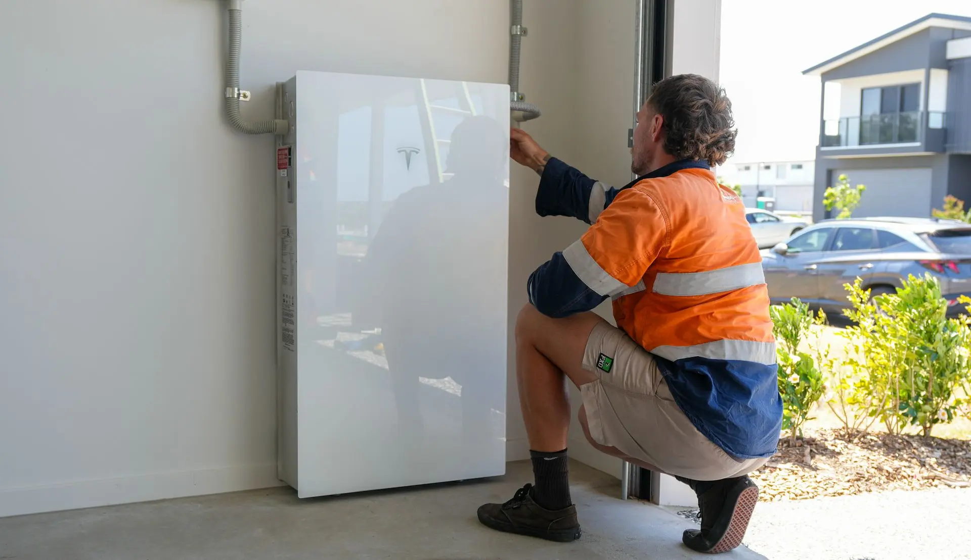 Springers Solar electrician installing a solar battery