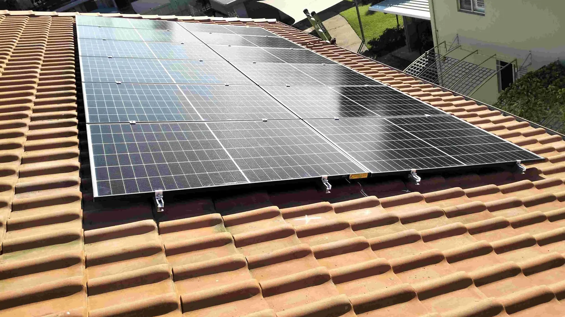 solar panel installation on terracotta tile roof